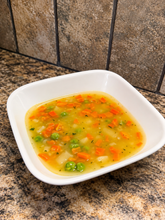 Load image into Gallery viewer, Bowl of chicken pot pie soup with potatoes, carrots, peas, and chicken
